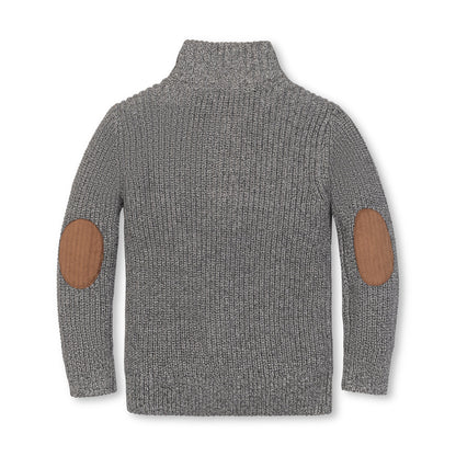 Baby wearing an Organic Mock Neck Sweater in cool weather