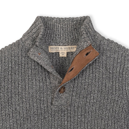 Baby wearing an Organic Mock Neck Sweater in cool weather