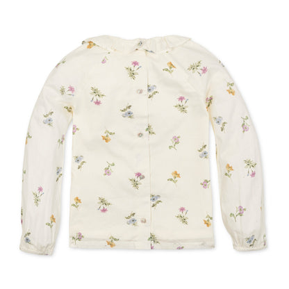 Organic Ruffle Collar Top paired with leggings for a classic baby outfit